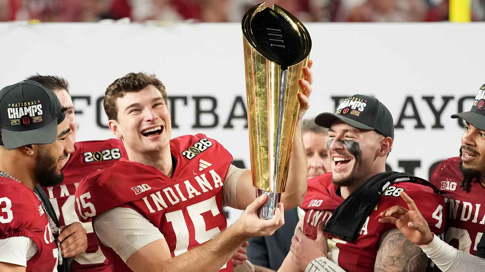 Indiana Hoosiers quarterback Fernando Mendoza (15) lifts the trophy after the College Football Playoff National Championship game against the Miami Hurricanes at Hard Rock Stadium.