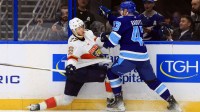 Florida Panthers center Eetu Luostarinen (27) and Tampa Bay Lightning defenseman Darren Raddysh (43) fight to control the puck during the second period at Benchmark International Arena.