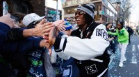 Feb 11, 2026; Seattle, WA, USA; Seattle Seahawks wide receiver Rashid Shaheed (22) high fives fans during Seattle Seahawks Super Bowl LX parade. Mandatory Credit: Kevin Ng-Imagn Images