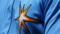 A view of the Rays logo on the jersey of a member of the Tampa Bay Rays against the Boston Red Sox at Charlotte Sports Park.