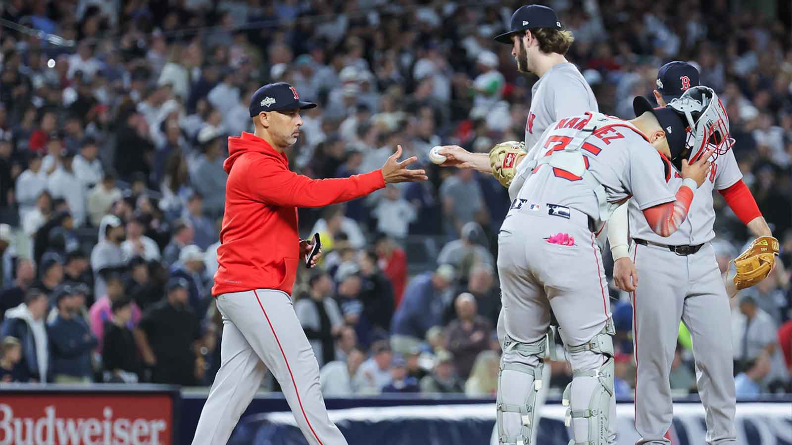 Boston Red Sox manager Alex Cora (13) makes a pitching change during the fifth inning against the New York Yankees during game two of the Wildcard round for the 2025 MLB playoffs at Yankee Stadium.
