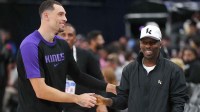 Sacramento Kings guard Zach LaVine (8) shakes hands with sports agent Rich Paul during the game against the LA Clippers at the Intuit Dome.