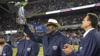 Sep 8, 2025; Chicago, Illinois, USA; Former Chicago Bear defensive end Richard Dent holds the Super Bowl Twenty trophy during half time at Soldier Field.