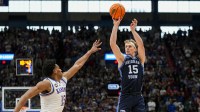 BYU Cougars guard Richie Saunders (15) shoots against Kansas Jayhawks forward Bryson Tiller (15) during the first half at Mizzou Arena.