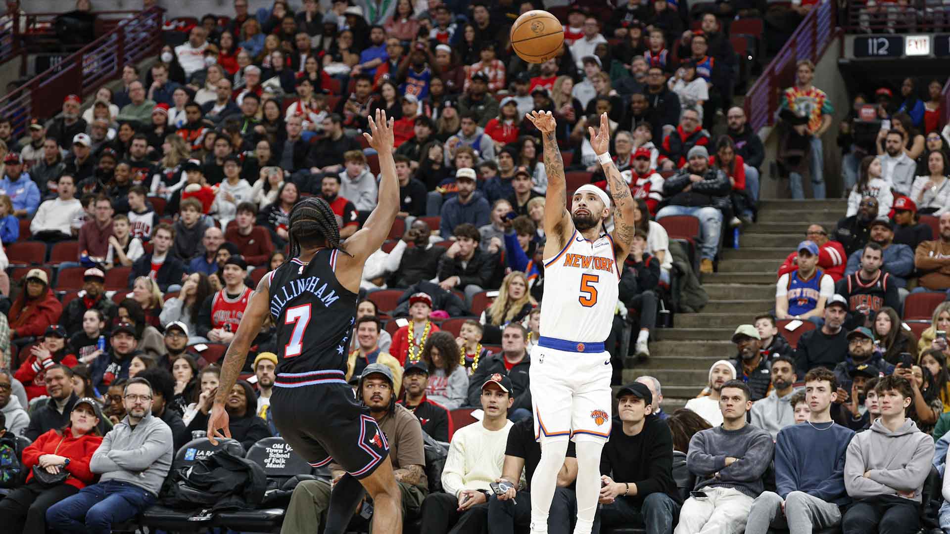 New York Knicks guard Jose Alvarado (5) shoots against Chicago Bulls Rob Dillingham (7) during the first half at United Center.