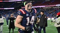 New England Patriots linebacker Robert Spillane (14) jogs off the field after defeating the Los Angeles Chargers in an AFC Wild Card Round game at Gillette Stadium.
