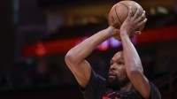 Rockets forward Kevin Durant (7) warms up before playing against the Los Angeles Clippers at Toyota Center