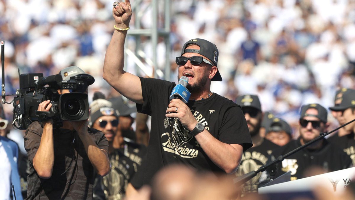 Dodgers player and Game 7 hero Miguel Rojas addresses the crowd during the 2025 World Series championship celebration at Dodger Stadium in Los Angeles on Monday, Nov. 3, 2025.
