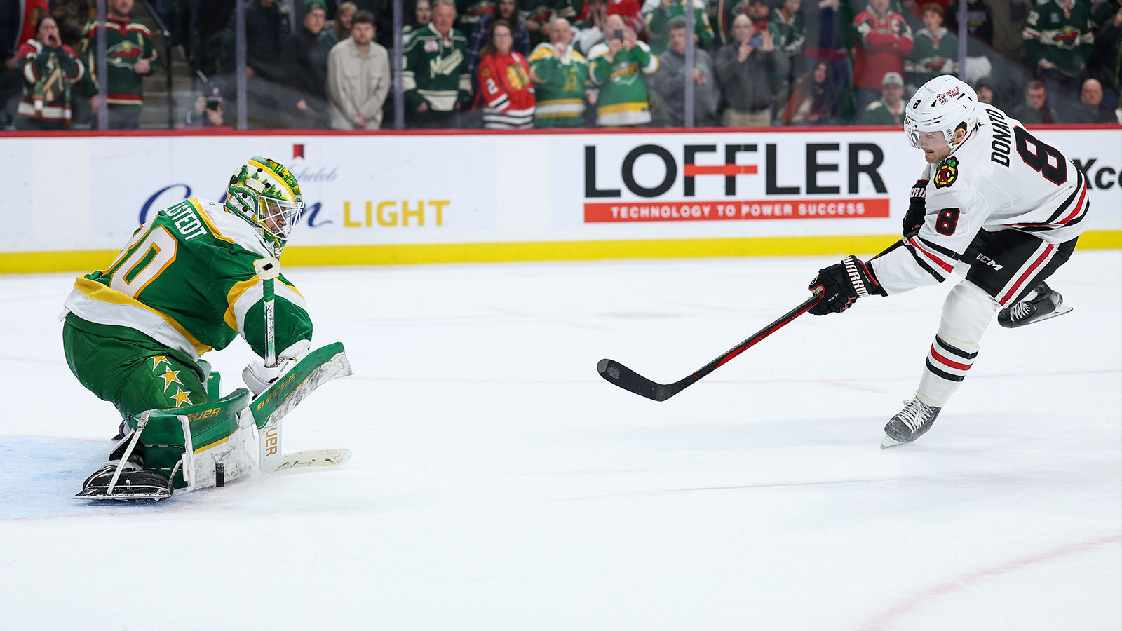 Minnesota Wild goaltender Jesper Wallstedt (30) makes a game winning save against Chicago Blackhawks center Ryan Donato (8) during a shootout at Grand Casino Arena. 