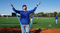 New York Mets pitcher Ryan Lambert stretches during spring training.