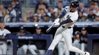 New York Yankees third baseman Ryan McMahon (19) hits a solo home run during the third inning against the Toronto Blue Jays during game four of the ALDS round for the 2025 MLB playoffs at Yankee Stadium.