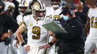 New Orleans Saints head coach Sean Payton talks with quarterback Drew Brees (9) against the Tampa Bay Buccaneers during the second half at Raymond James Stadium.