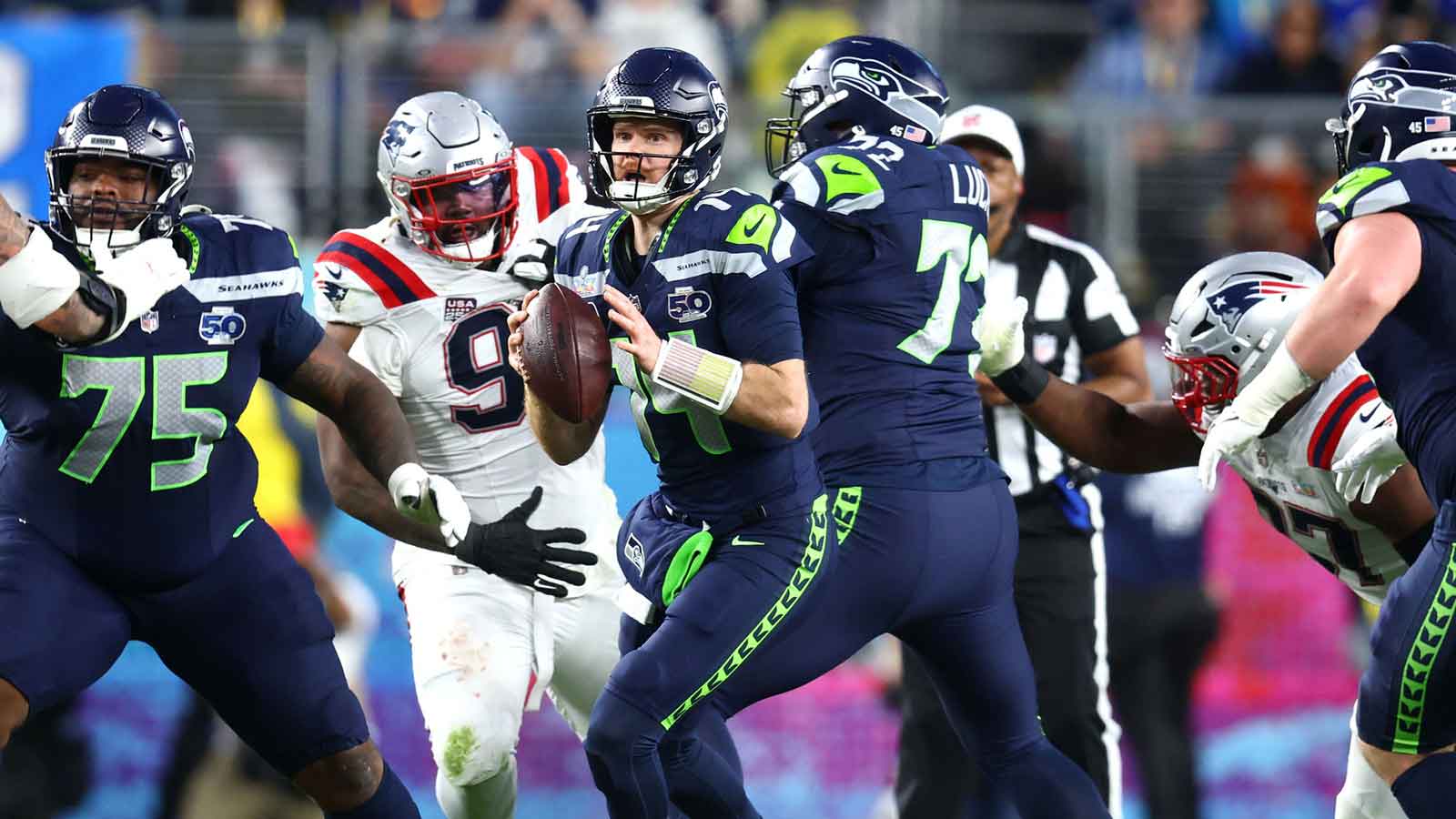 Seattle Seahawks quarterback Sam Darnold (14) looks to pass against the New England Patriots during the third quarter in Super Bowl LX at Levi's Stadium.