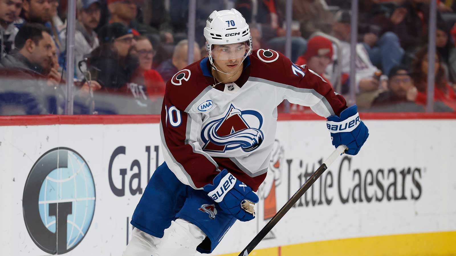 Colorado Avalanche defenseman Sam Malinski (70) skates with the puck in the second period against the Detroit Red Wings at Little Caesars Arena.