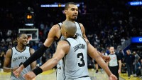 San Antonio Spurs forward Victor Wembanyama (1), forward Keldon Johnson (3), and guard De'Aaron Fox (4) celebrate as the clock expires against the Golden State Warriors in the fourth quarter at Chase Center.