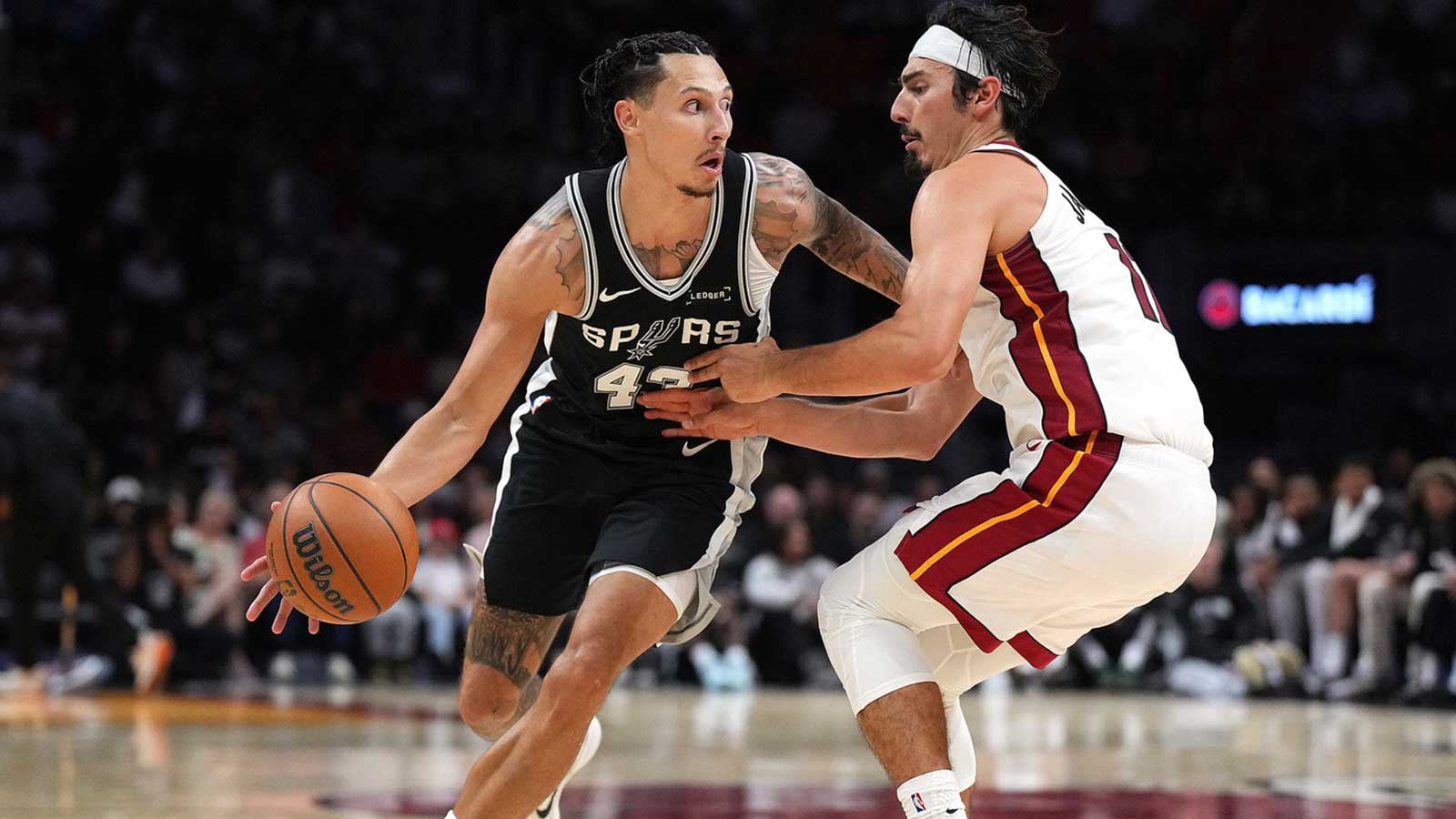 San Antonio Spurs forward Lindy Waters III (43) drives past Miami Heat guard Jaime Jaquez Jr. (11) during the second half at Kaseya Center.