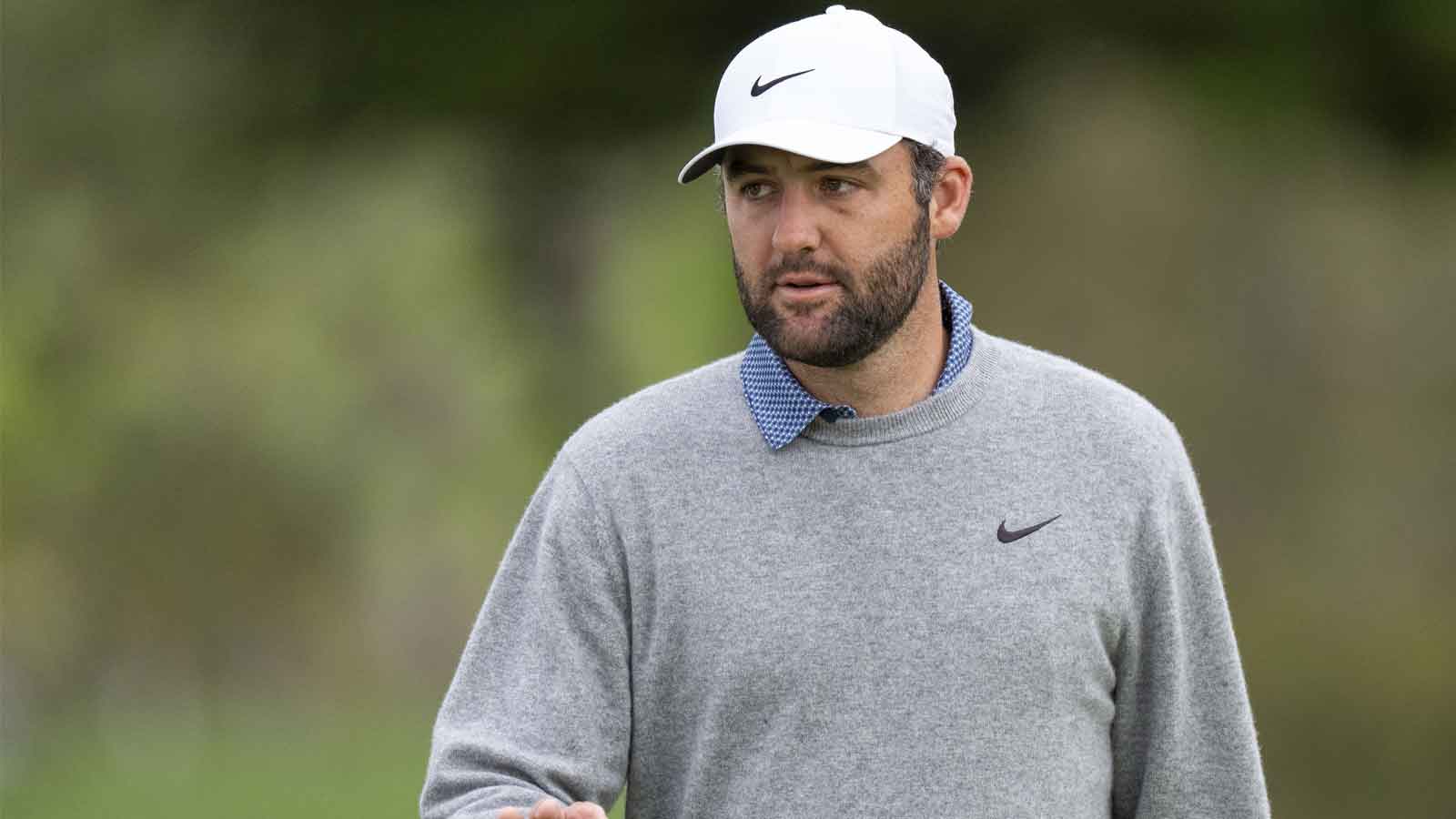 Scottie Scheffler acknowledges the crowd on the second hole during the final round of the AT&T Pebble Beach Pro-Am golf tournament at Pebble Beach Golf Links.