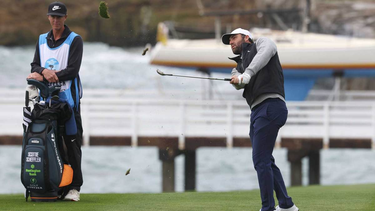 Scottie Scheffler hits his fairway shot on the fourth hole during the final round of the AT&T Pebble Beach Pro-Am golf tournament at Pebble Beach Golf Links.