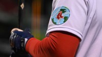 A detailed view of an Earth Day patch on the arm of Boston Red Sox center fielder Franchy Cordero (16) during the fourth inning of a game against the Seattle Mariners at Fenway Park.