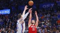 Houston Rockets center Alperen Sengun (28) shoots as Oklahoma City Thunder center/forward Isaiah Hartenstein (55) defends during the second half at Paycom Center