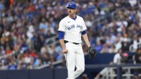 Toronto Blue Jays starting pitcher Shane Bieber (57) walks towards the dugout against the Houston Astros during the first inning at Rogers Centre.