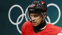 Sidney Crosby of Canada walks out to the ice before a men's ice hockey quarterfinal during the Milano Cortina 2026 Olympic Winter Games at Milano Santagiulia Ice Hockey Arena.