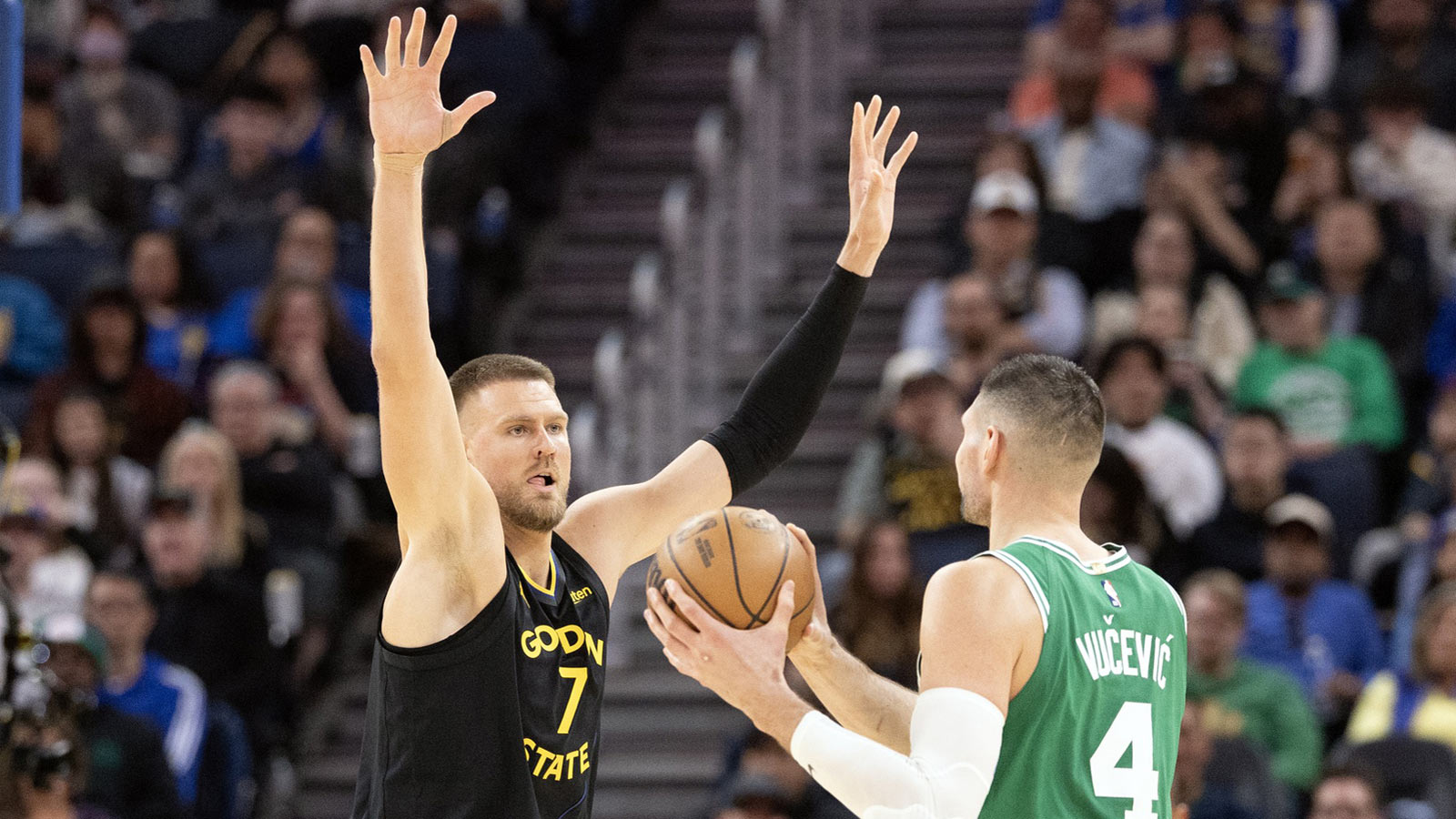Golden State Warriors center Kristaps Porzingis (7) guards Boston Celtics center Nikola Vucevic (4) during the third quarter at Chase Center. 