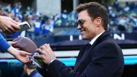 Tom Brady signs autographs before the 2026 NFC Championship Game between the Seattle Seahawks and the Los Angeles Rams at Lumen Field.