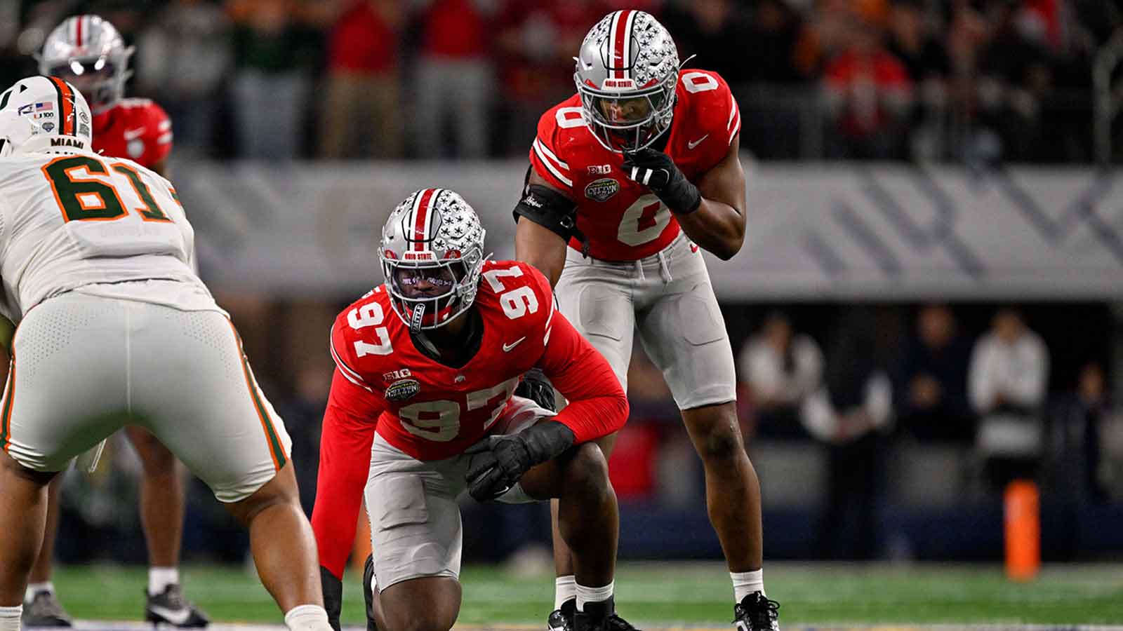 Ohio State Buckeyes defensive end Kenyatta Jackson Jr. (97) and linebacker Sonny Styles (0) get into position during the 2025 Cotton Bowl and quarterfinal game of the College Football Playoff at AT&T Stadium.