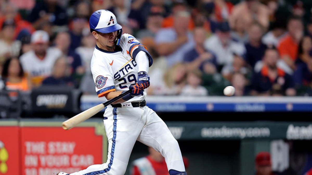 Houston Astros second baseman Ramon Urias (29) hits a home run to left field against the Los Angeles Angels during the second inning at Daikin Park.
