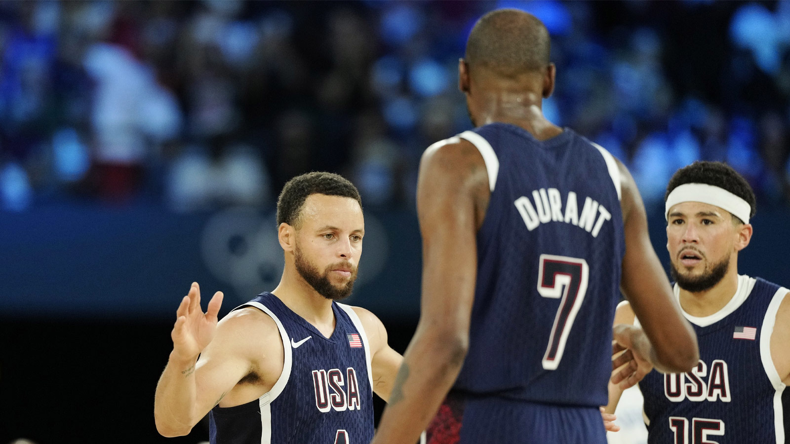 United States shooting guard Stephen Curry (4) and guard Kevin Durant (7) react in the second half against France in the men's basketball gold medal game during the Paris 2024 Olympic Summer Games at Accor Arena.