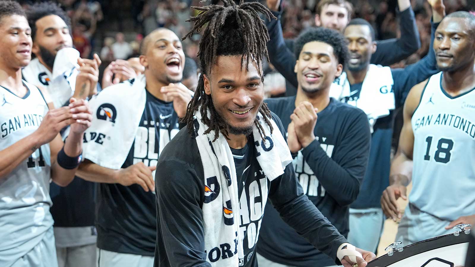 San Antonio Spurs guard Stephon Castle (5) beats the drum after the game against the Dallas Mavericks at Frost Bank Center.