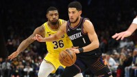 Phoenix Suns guard Devin Booker (1) against Los Angeles Lakers guard Marcus Smart (36) in the first half at Mortgage Matchup Center