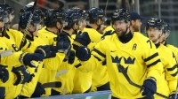 Victor Hedman of Sweden celebrates scoring their fifth goal with teammates in men's ice hockey group B play during the Milano Cortina 2026 Olympic Winter Games at Milano Santagiulia Ice Hockey Arena.