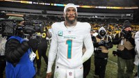 Miami Dolphins quarterback Tua Tagovailoa (1) leaves the field following a game against the Pittsburgh Steelers at Acrisure Stadium.