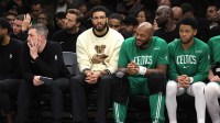 Boston Celtics injured forward Jayson Tatum (0) watches from the bench during the third quarter against the Brooklyn Nets at Barclays Center.