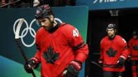 Tom Wilson of Canada walks onto the ice before a men's ice hockey quarterfinal during the Milano Cortina 2026 Olympic Winter Games at Milano Santagiulia Ice Hockey Arena.