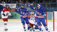 Joy Dunne (24) of Team United States celebrates after scoring a goal against Team Czechia in women's ice hockey Group A play during the Milano Cortina 2026 Olympic Winter Games at Milano Rho Ice Hockey Arena.