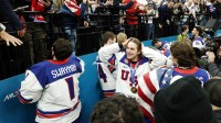 Jack Hughes (86) of the United States celebrates with fans after defeating Canada in the men's ice hockey gold medal game during the Milano Cortina 2026 Olympic Winter Games at Milano Santagiulia Ice Hockey Arena.