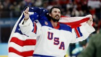 Connor Hellebuyck (37) of the United States celebrates after defeating Canada in the men's ice hockey gold medal game during the Milano Cortina 2026 Olympic Winter Games at Milano Santagiulia Ice Hockey Arena.