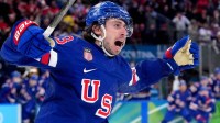 Quinn Hughes (43) of the United States celebrates his winning goal in overtime against Sweden in a men's ice hockey quarterfinal during the Milano Cortina 2026 Olympic Winter Games at Milano Santagiulia Ice Hockey Arena.