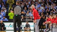 Texas Tech Red Raiders head coach Grant McCasland talks with an official during the first half against the UCF Knights at Addition Financial Arena.