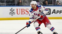 New York Rangers center Vincent Trocheck (16) skates with the puck against the New York Islanders during the third period at UBS Arena.