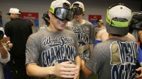 Los Angeles Dodgers pitcher Yoshinobu Yamamoto (18) celebrates with champagne in the locker room after defeating the Toronto Blue Jays in the 2025 MLB World Series at Rogers Centre.