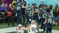 Seattle Seahawks tight end AJ Barner (88) celebrates with teammates after scoring a touchdown against the New England Patriots in the second half in Super Bowl LX at Levi's Stadium.
