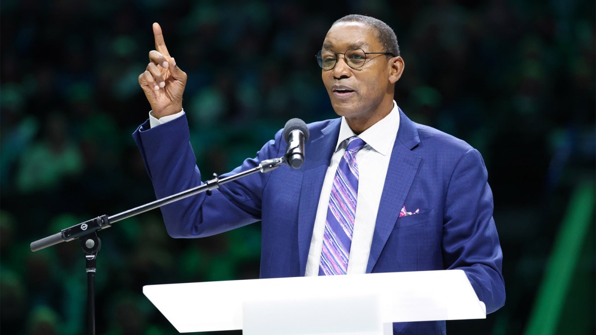 Detroit Pistons former player Isiah Thomas speaks at the retirement ceremony of Dallas Mavericks former player Mark Aguirre at halftime of teh game against the Charlotte Hornets at American Airlines Center.