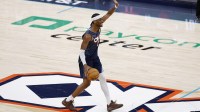 Thunder guard Shai Gilgeous-Alexander (2) gestures to his team as he dribbles down the court against the Denver Nuggets during the fourth quarter at Paycom Center