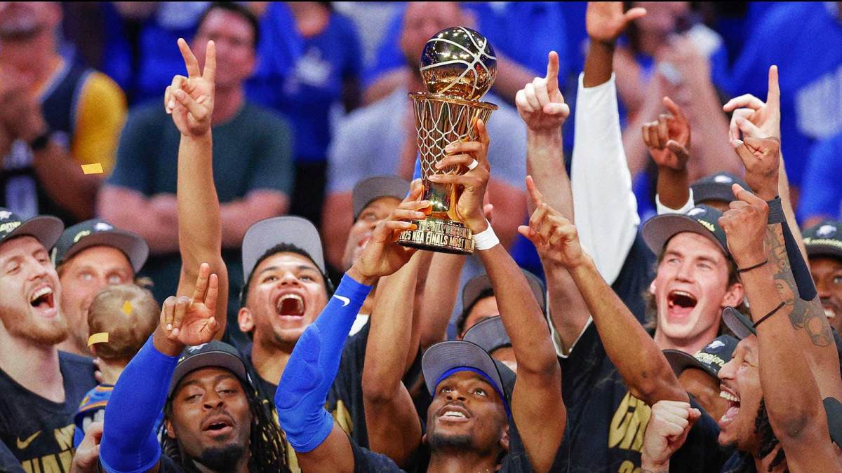 Oklahoma City Thunder guard Shai Gilgeous-Alexander (2) holds up his NBA Finals Bill Russell MVP trophy at the end of game seven of the 2025 NBA Finals after defeating the Indiana Pacers at Paycom Center.