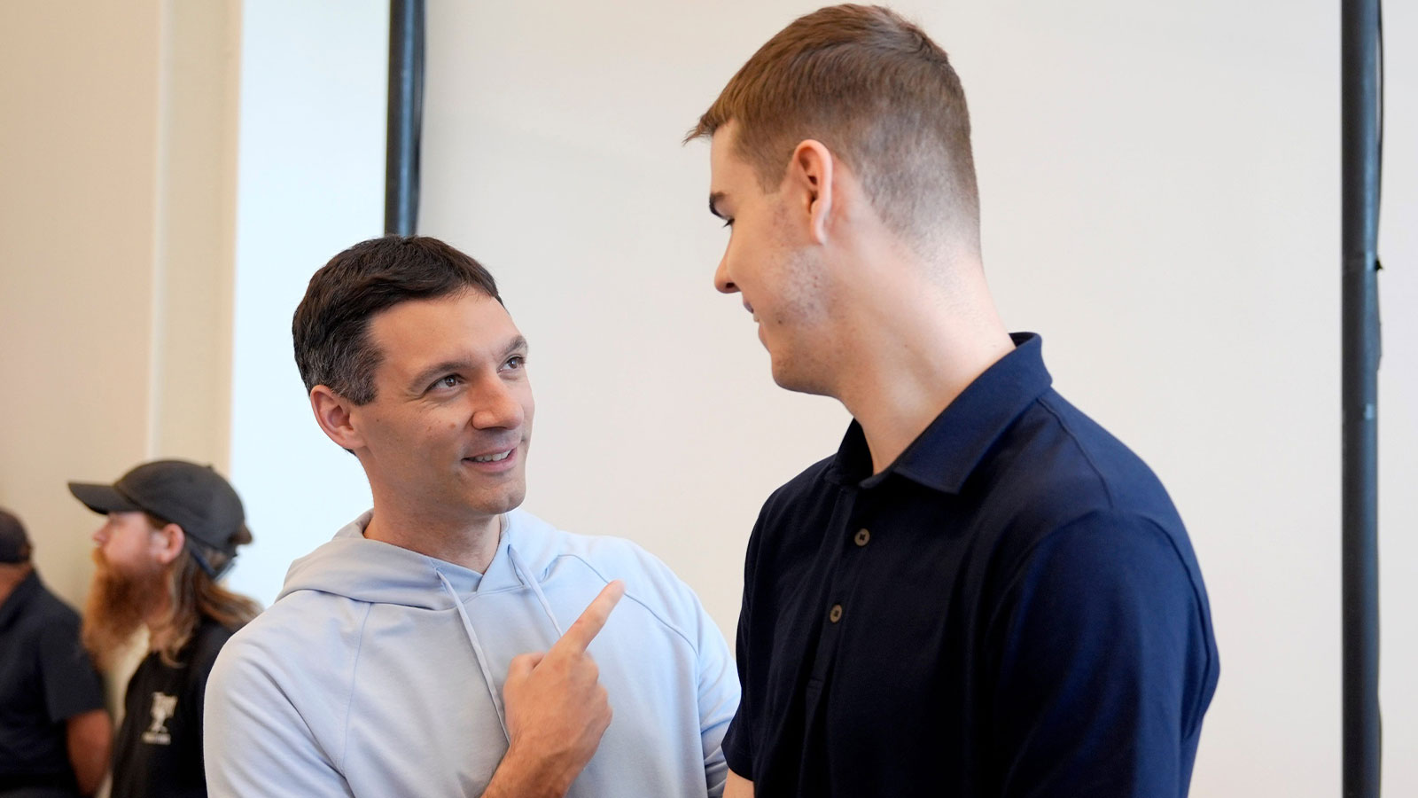 Thunder head coach Mark Daigneault talks with Nikola Topic during an introductory press conference for the 2024 Thunder draft picks at Oklahoma Contemporary Arts Center in Oklahoma City