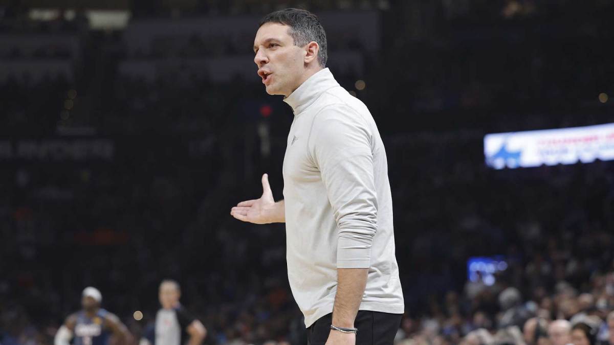 Thunder Head Coach Mark Daigneault yells to his team during a play against the Denver Nuggets during the first quarter at Paycom Center with Thunder's Lu Dort and Nuggets' Nikola Jokic in the background